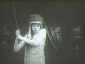 Judith (Blanche Sweet) prepares to behead Holofernes in Judith of Bethulia.