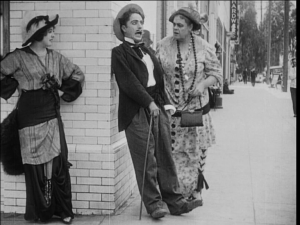 Charlie Chaplin, caught between Mabel Normand and Marie Dressler in Tillie's Punctured Romance (US: Keystone, 1914)